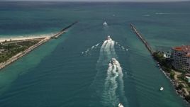 5K aerial stock footage approach a line of ferries sailing on Government Cut in Miami, Florida Aerial Stock Footage | AX0020_042