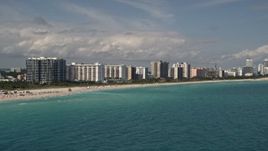 5K aerial stock footage of a row of beachfront condominium complexes in Miami Beach, Florida Aerial Stock Footage | AX0020_049