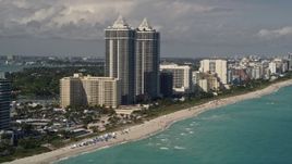 5K aerial stock footage of twin towers of beachfront skyscrapers in Miami Beach, Florida Aerial Stock Footage | AX0020_054E