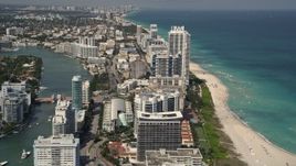 5K aerial stock footage fly over beachfront condos on the coast in Miami Beach, Florida Aerial Stock Footage | AX0020_059E