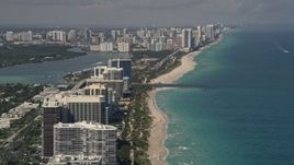 5K aerial stock footage of beachfront condos and hotels in Bal Harbour, with a view to Sunny Isles Beach, Florida Aerial Stock Footage | AX0020_067E