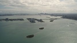 5K aerial stock footage of small island with waterfront homes in Biscayne Bay, Florida Aerial Stock Footage | AX0020_101
