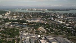 5K aerial stock footage of North Miami suburban neighborhood, reveal Bal Harbour, Florida Aerial Stock Footage | AX0021_003E