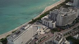 5K aerial stock footage of condominiums by the beach in Miami Beach, Florida Aerial Stock Footage | AX0021_027