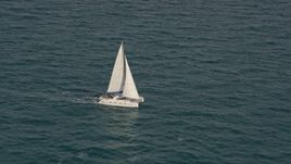 5K aerial stock footage of catamaran sailing on the blue ocean near South Beach, Florida Aerial Stock Footage | AX0021_041E
