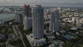 5K aerial stock footage of modern skyscrapers near the beach in South Beach, Florida Aerial Stock Footage | AX0021_059E