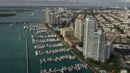 5K aerial stock footage of waterfront residential skyscrapers and a marina in South Beach, Florida Aerial Stock Footage | AX0021_062