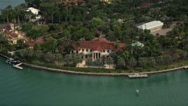 5K aerial stock footage of a bayfront island estate on Star Island, Florida Aerial Stock Footage | AX0021_072E