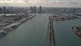5K aerial stock footage tilt from MacArthur Causeway to reveal Downtown Miami skyscrapers in Florida Aerial Stock Footage | AX0021_076