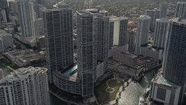 5K aerial stock footage fly over Miami River to approach high-rise complex in Downtown Miami, Florida Aerial Stock Footage | AX0021_080E