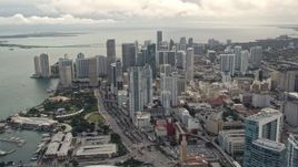 5K aerial stock footage pan from four skyscrapers to reveal and approach Downtown Miami high-rises, Florida Aerial Stock Footage | AX0021_096E