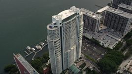 5K aerial stock footage approach the Santa Maria waterfront high-rise in Downtown Miami, Florida Aerial Stock Footage | AX0021_107E