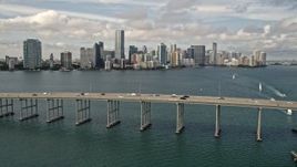 5K aerial stock footage tilt to reveal and approach Rickenbacker Causeway and Downtown Miami skyline, Florida Aerial Stock Footage | AX0021_115E