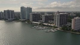 5K aerial stock footage flyby waterfront condo complexes on the shore of Biscayne Bay in Downtown Miami, Florida Aerial Stock Footage | AX0021_126