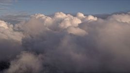 5K aerial stock footage approach thick cloud cover at sunset over Miami, Florida Aerial Stock Footage | AX0022_003