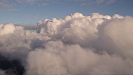 5K aerial stock footage approach thick cloud formation over Miami at sunset, Florida Aerial Stock Footage | AX0022_008E