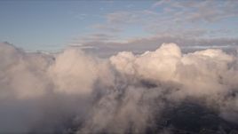 5K aerial stock footage pan across formation of clouds at sunset over Miami, Florida Aerial Stock Footage | AX0022_010