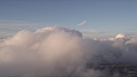 5K aerial stock footage of a thick formation of clouds over Miami at sunset, Florida Aerial Stock Footage | AX0022_011