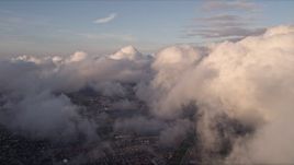 5K aerial stock footage pan across cloud formation at sunset over Miami, Florida Aerial Stock Footage | AX0022_013E