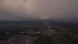 5K aerial stock footage fly under the edge of a cloud formation at sunset near Zoo Miami, Florida Aerial Stock Footage | AX0022_020E