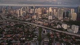 5K aerial stock footage tilt from SW 3rd Avenue to reveal skyscrapers in Downtown Miami at sunset, Florida Aerial Stock Footage | AX0022_026E