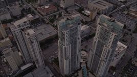 5K aerial stock footage of the Vizcayne towers in Downtown Miami at sunset, Florida Aerial Stock Footage | AX0022_033E