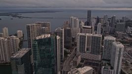 5K aerial stock footage approach skyscrapers on the bay shore in Downtown Miami at sunset, Florida Aerial Stock Footage | AX0022_035E