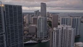 5K aerial stock footage fly between Brickell Key and Icon Brickell in Downtown Miami at sunset, Florida Aerial Stock Footage | AX0022_046E