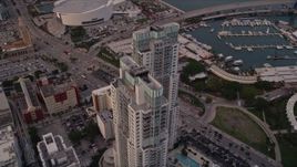 5K aerial stock footage approach the modern towers of Vizcayne in Downtown Miami at sunset, Florida Aerial Stock Footage | AX0022_048E