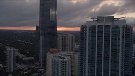 5K aerial stock footage flyby Four Seasons Hotel and Jade at Brickell Bay in Downtown Miami at sunset, Florida Aerial Stock Footage | AX0022_059