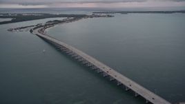 5K aerial stock footage orbit bridge on the Rickenbacker Causeway at sunset, Florida Aerial Stock Footage | AX0022_071E