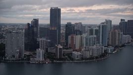 5K aerial stock footage approach waterfront skyscrapers and high-rise hotel at sunset in Downtown Miami, Florida Aerial Stock Footage | AX0022_078
