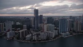5K aerial stock footage flyby high-rise hotel and waterfront skyscrapers at sunset in Downtown Miami, Florida Aerial Stock Footage | AX0022_079E