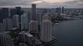 5K aerial stock footage of Brickell Key skyscrapers at sunset, reveal the river in Downtown Miami, Florida Aerial Stock Footage | AX0022_081E