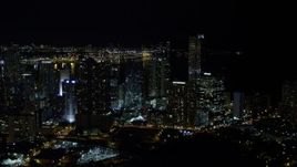 5K aerial stock footage of One Broadway and Four Seasons Hotel skyscrapers in Downtown Miami at night, Florida Aerial Stock Footage | AX0023_007