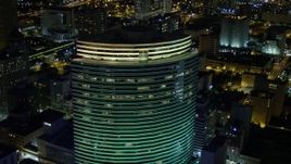 5K aerial stock footage of Miami Tower in Downtown Miami at night, Florida Aerial Stock Footage | AX0023_022