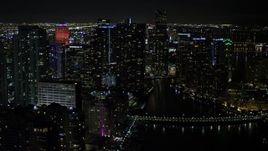 5K aerial stock footage of Brickell Key and Downtown Miami skyscrapers at nighttime, Florida Aerial Stock Footage | AX0023_035