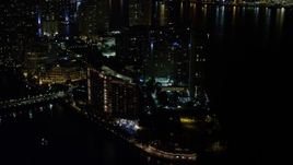 5K aerial stock footage approach Mandarin Oriental Hotel on Brickell Key in Downtown Miami at night, Florida Aerial Stock Footage | AX0023_036