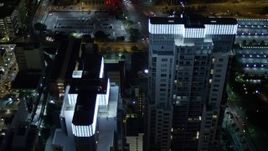 5K aerial stock footage approach twin skyscrapers at night in Downtown Miami, Florida Aerial Stock Footage | AX0023_039E