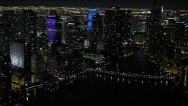 5K aerial stock footage pan across Downtown Miami skyscrapers at night, Florida Aerial Stock Footage | AX0023_054