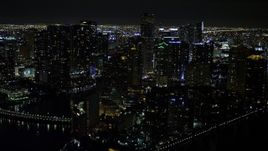 5K aerial stock footage flyby Brickell Key high-rises at night in Downtown Miami, Florida Aerial Stock Footage | AX0023_055E