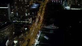 5K aerial stock footage of yacht docked by Collins Avenue at night in  Miami Beach, Florida Aerial Stock Footage | AX0023_095E