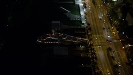 5K aerial stock footage orbit Fontainebleau Miami Beach Resort Hotel and yacht at night, Florida Aerial Stock Footage | AX0023_098E