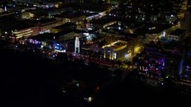 5K aerial stock footage of row of hotels on Ocean Drive at night in South Beach, Florida Aerial Stock Footage | AX0023_110E