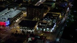 5K aerial stock footage of orbit small hotel and city streets at night in South Beach, Florida Aerial Stock Footage | AX0023_113