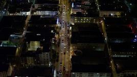 5K aerial stock footage fly over cars on Collins Avenue at night through South Beach, Florida Aerial Stock Footage | AX0023_114E