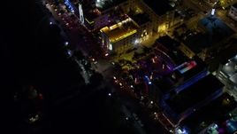 5K aerial stock footage of a bird's eye view of Ocean Drive's hotels in South Beach at night, Florida Aerial Stock Footage | AX0023_120E