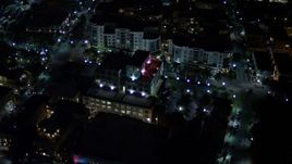 5K aerial stock footage of approach South Beach office building at night, Florida Aerial Stock Footage | AX0023_126