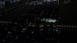 5K aerial stock footage of mansions and tennis courts on Palm Island at night in Florida Aerial Stock Footage | AX0023_134