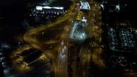 5K aerial stock footage fly over traffic on the MacArthur Causeway through Watson Island at night, Florida Aerial Stock Footage | AX0023_136